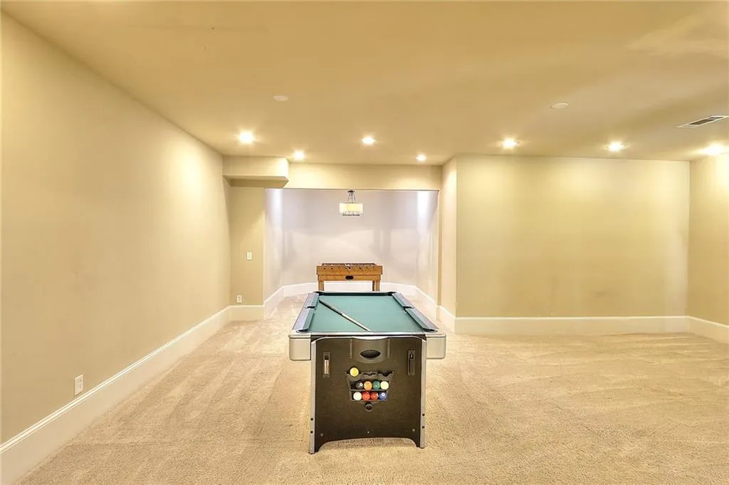 Playroom featuring light carpet and pool table
