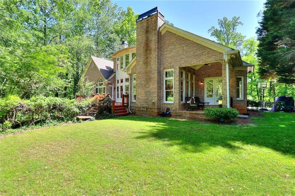 Back of house with a lawn