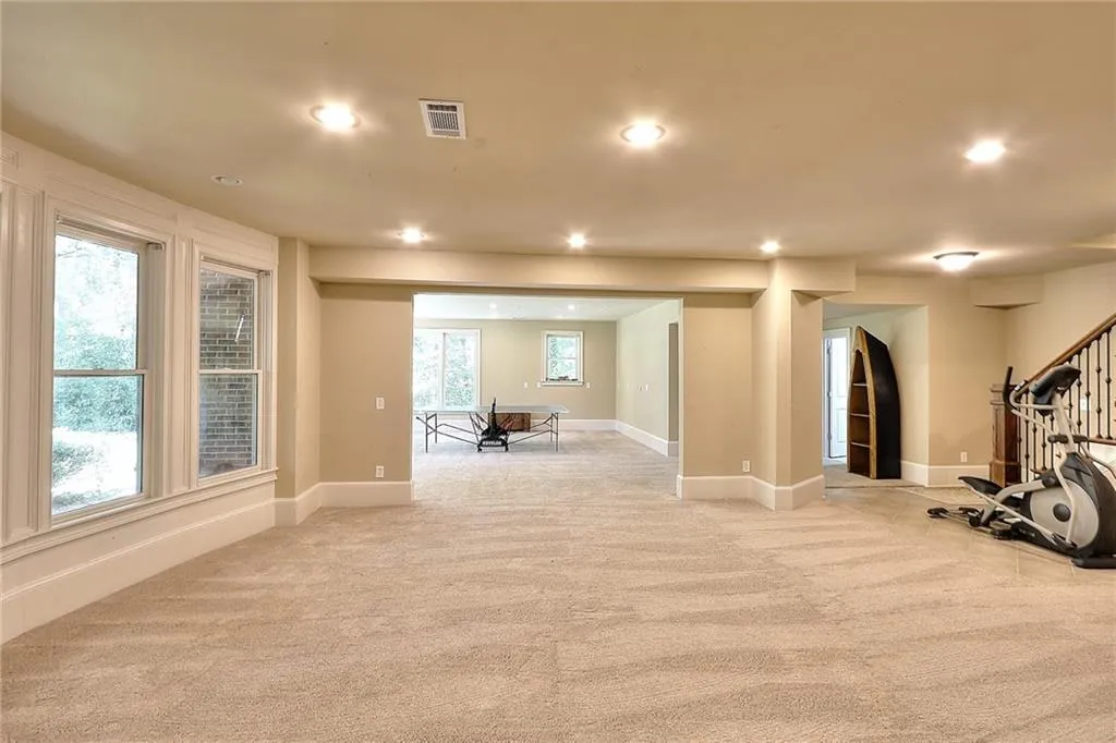 Workout area with light carpet and a wealth of natural light