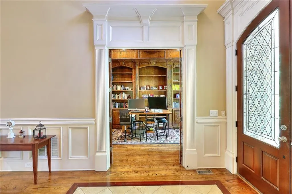 Entrance foyer with wood-type flooring