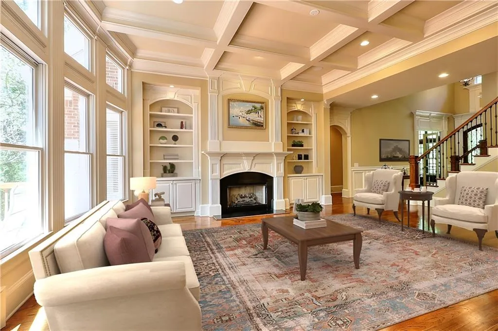 Digitally Staged-Living room with hardwood / wood-style flooring, coffered ceiling, built in shelves, beamed ceiling, and crown molding