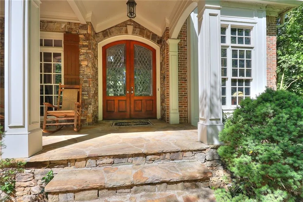View of exterior entry with covered porch