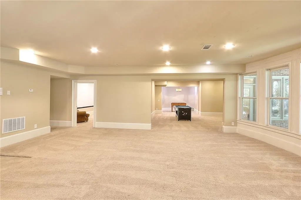 Basement with light carpet