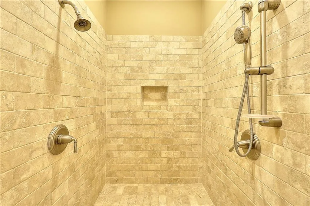 Bathroom featuring tiled shower