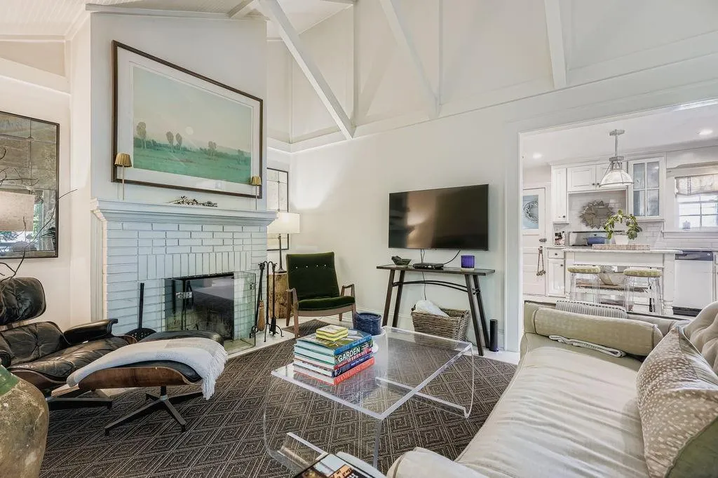 Living area with a brick fireplace
