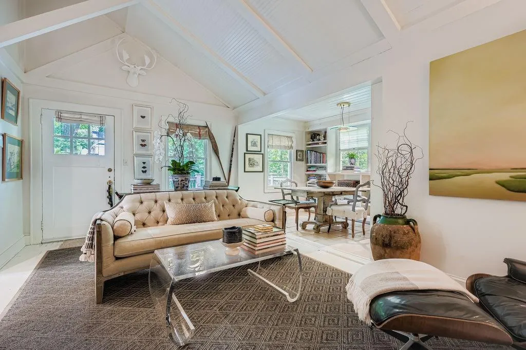 Living area with healthy amount of natural light and tile patterned flooring