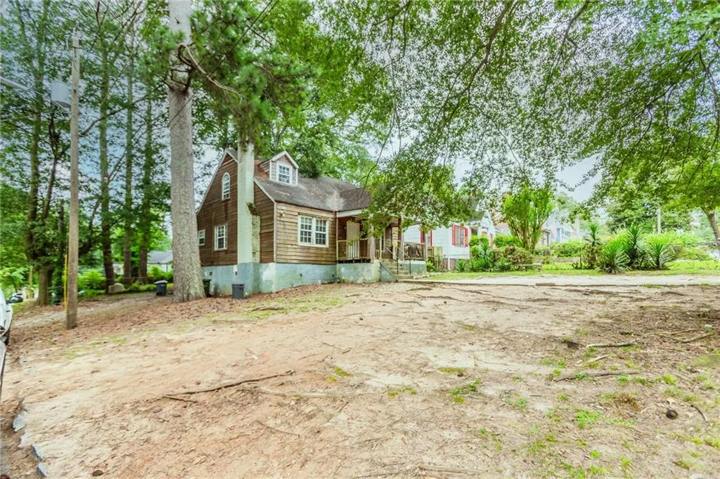 View of front of property with a porch and crawl space