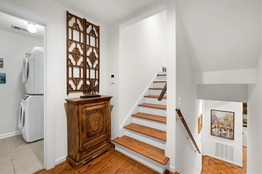 This is the level you enter from the two-car garage. Laundry to the left and stairs down lead to terrace level and guest bedroomo #2.