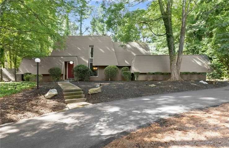 Distinctive architectural residence set among mature trees