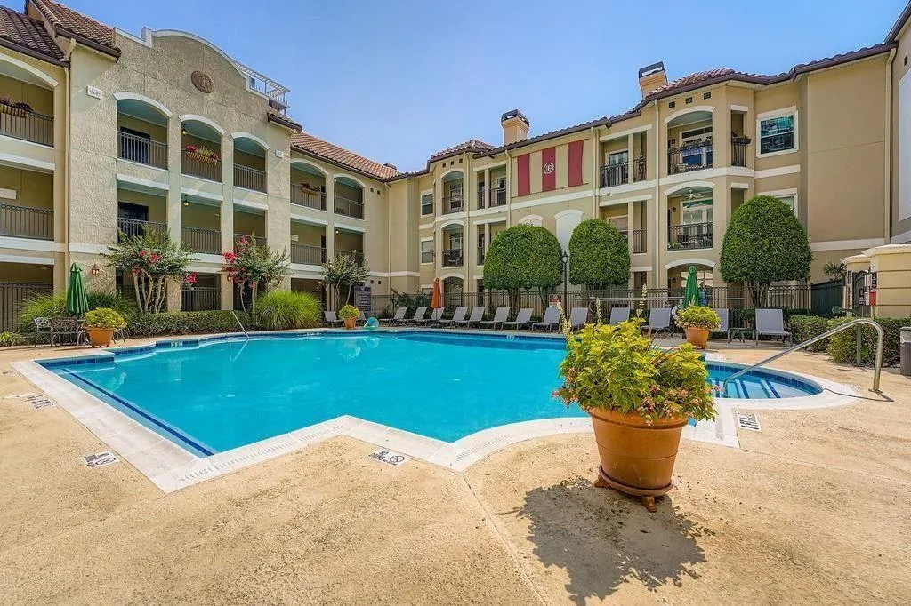 Community pool featuring a patio area