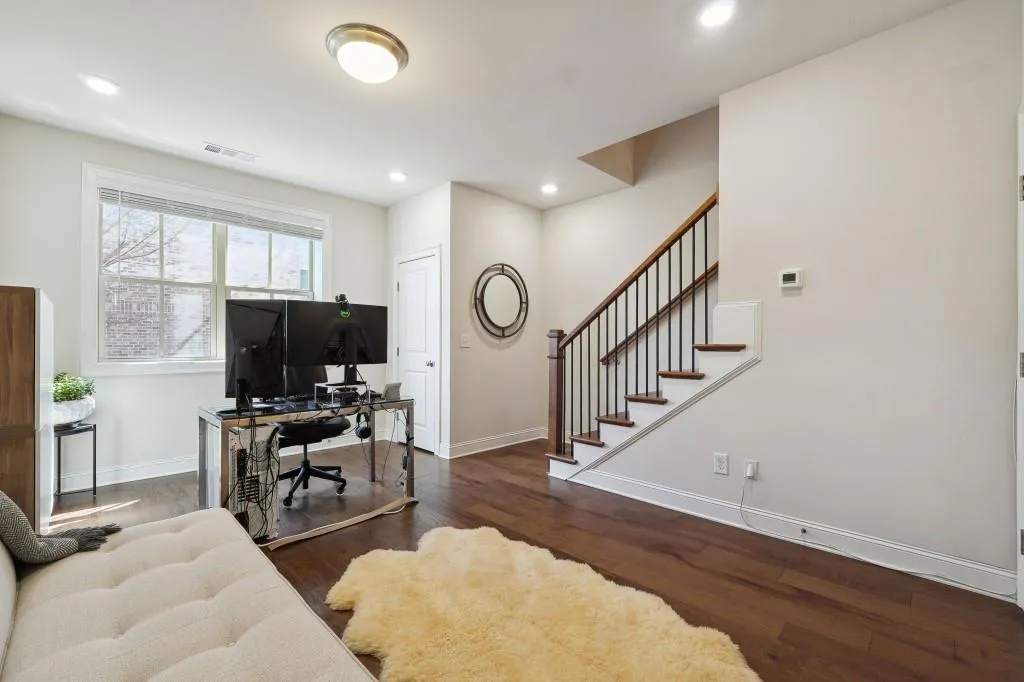 Living room with dark hardwood / wood-style floors
