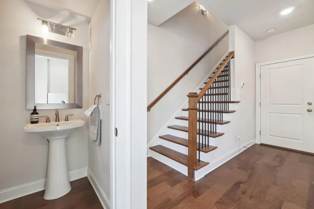 Staircase featuring dark hardwood / wood-style floors