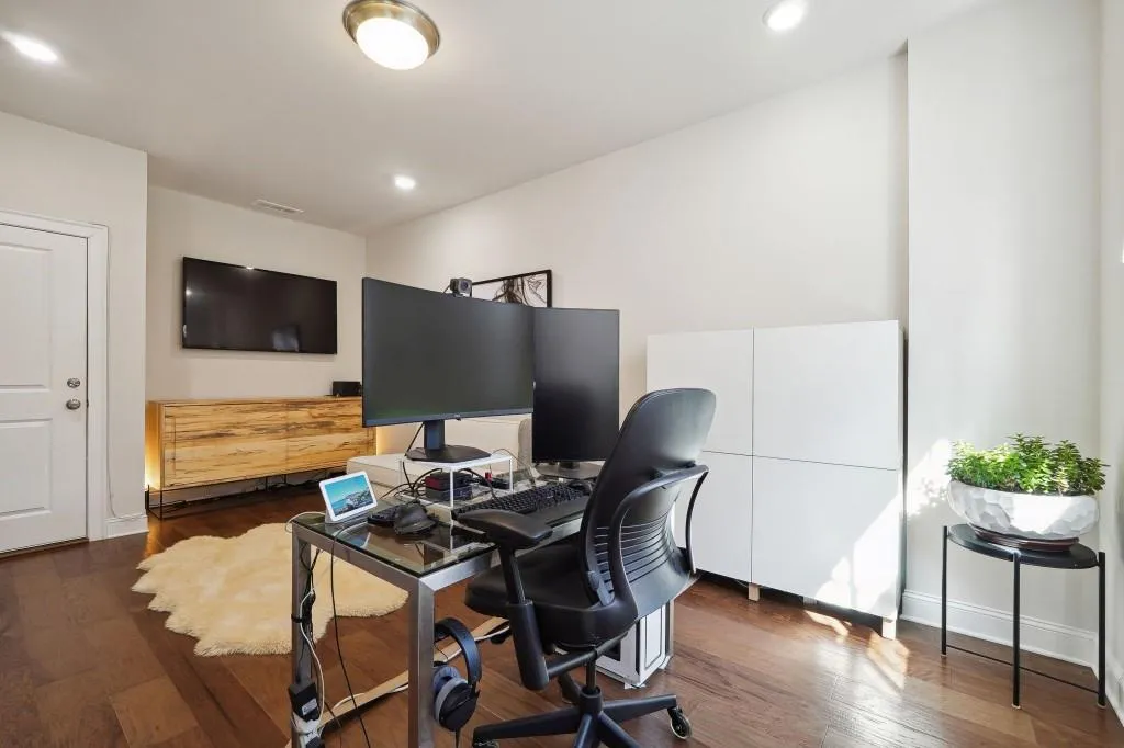 Office space featuring dark hardwood / wood-style flooring