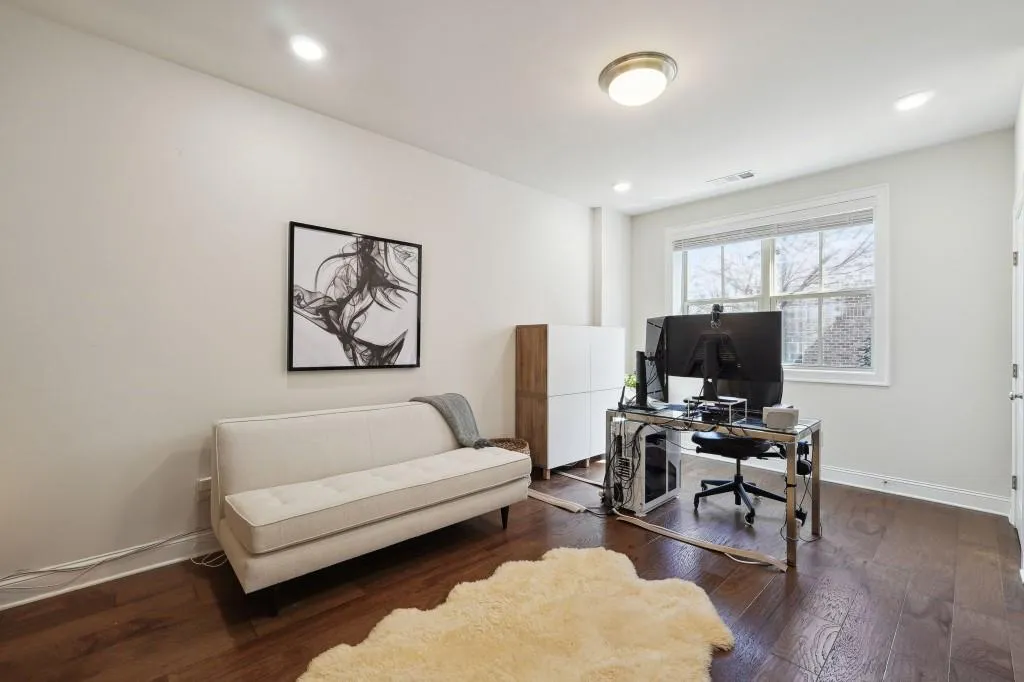 Office space featuring dark hardwood / wood-style floors