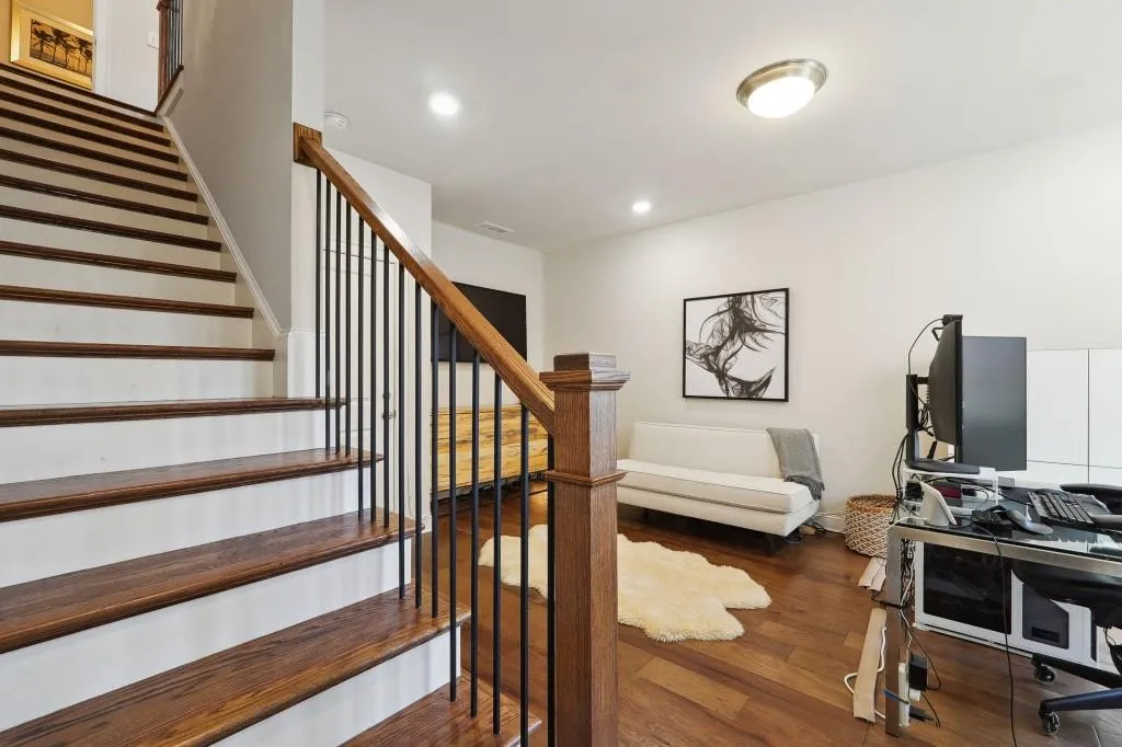 Stairway with dark wood-type flooring