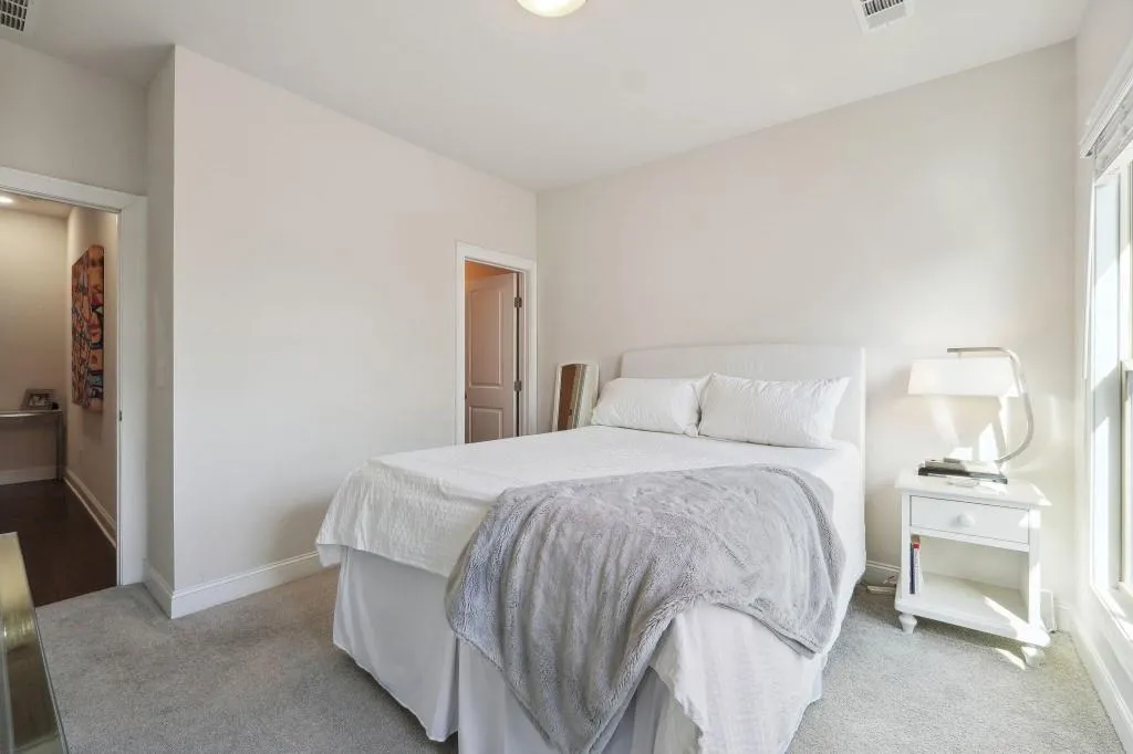 Bedroom with light carpet