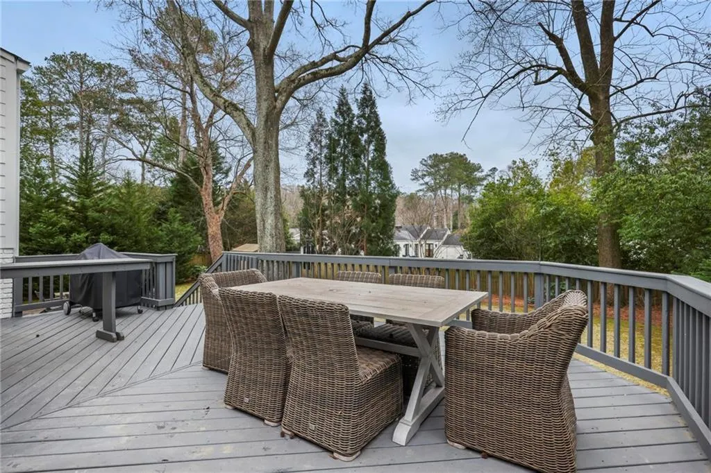 Wooden terrace featuring outdoor dining area