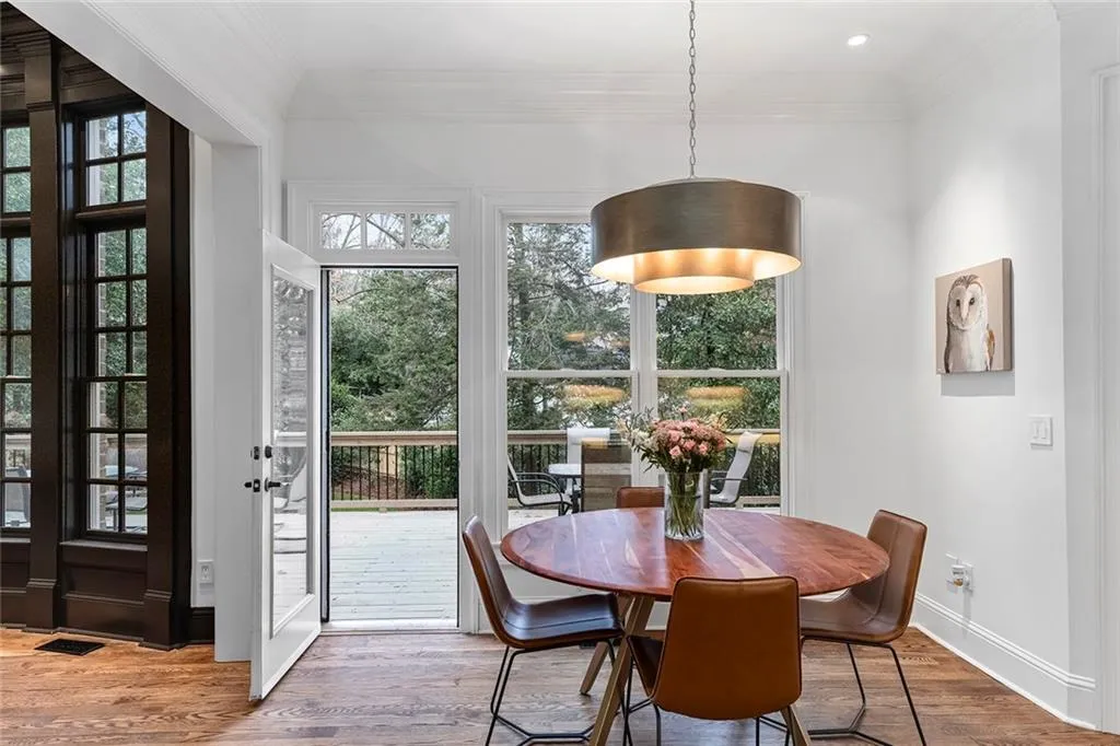 Dining room featuring wood finished floors and ornamental molding