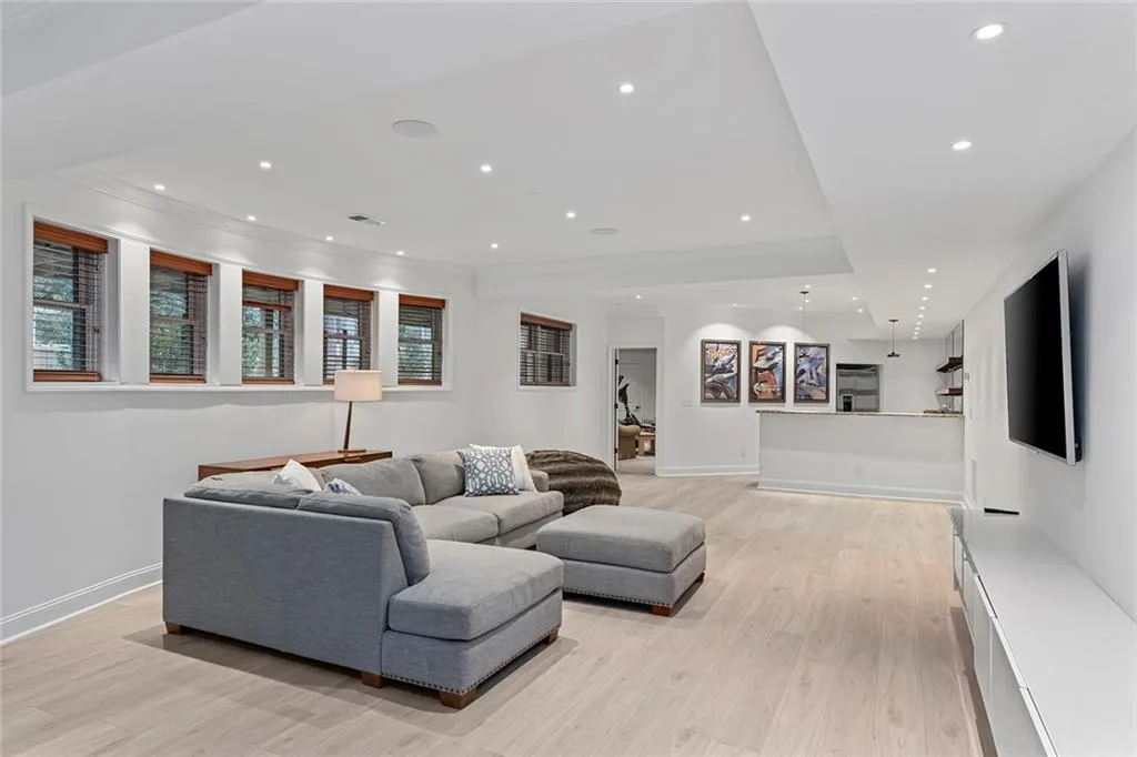 Living room with recessed lighting and light wood-type flooring