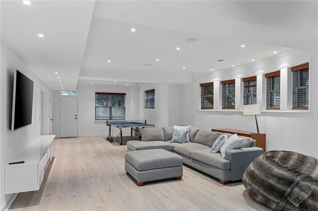 Living room featuring recessed lighting and light wood-type flooring