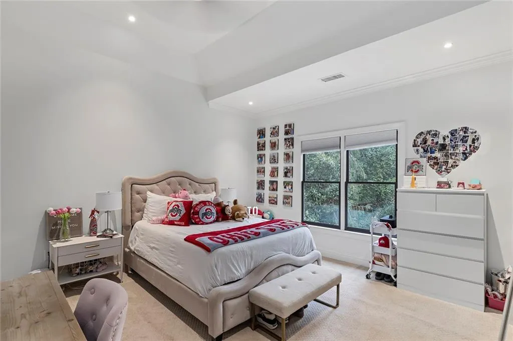 Carpeted bedroom featuring recessed lighting and baseboards
