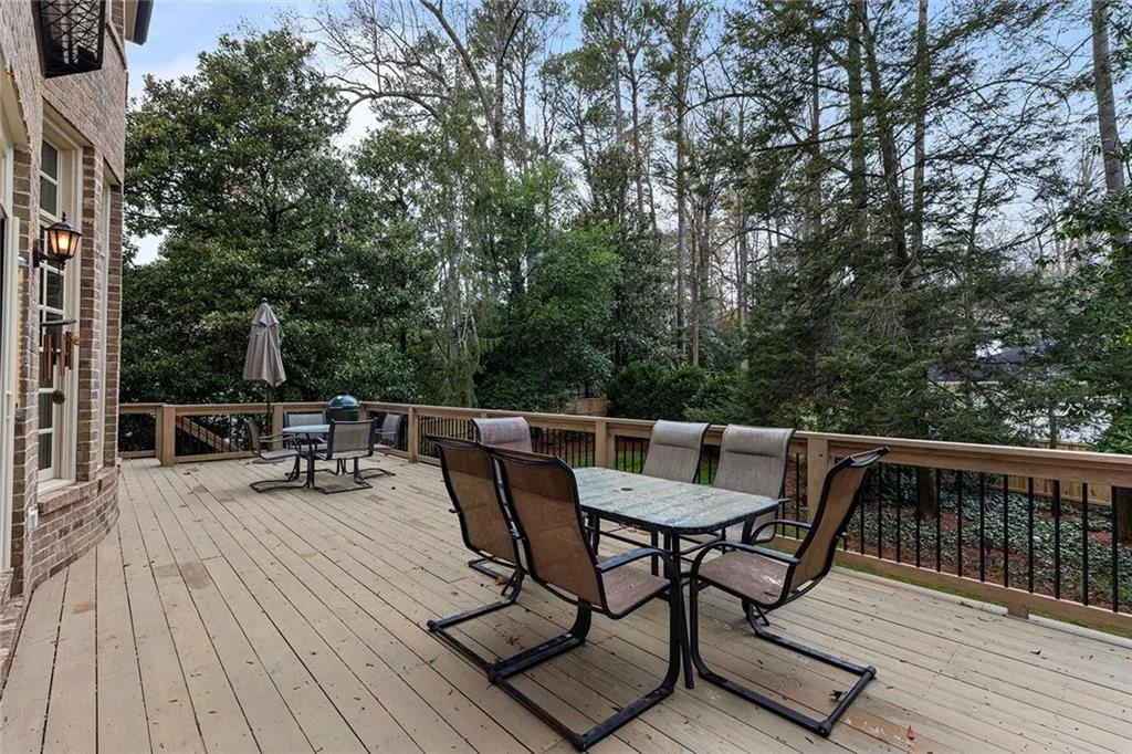 Wooden deck featuring outdoor dining area