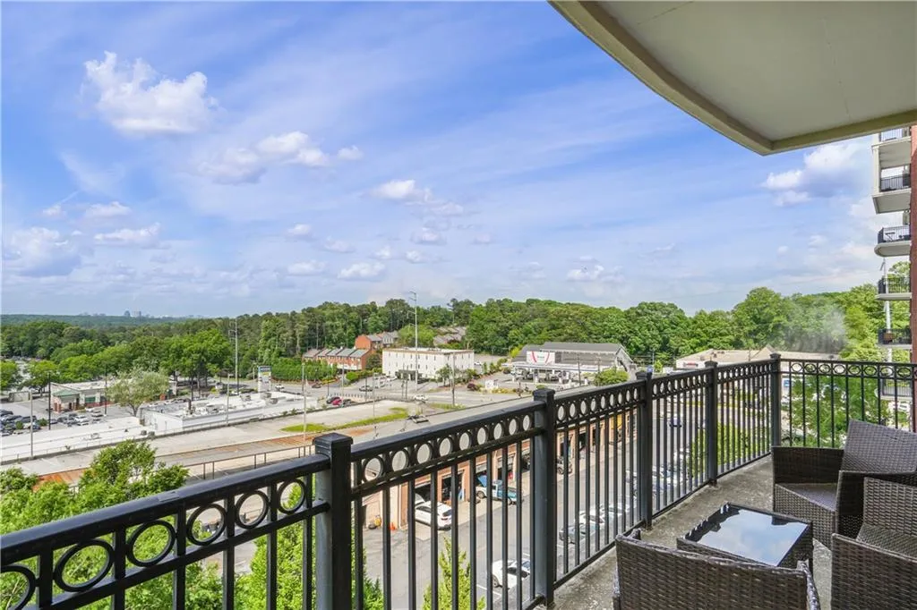 Balcony with view of wooded area