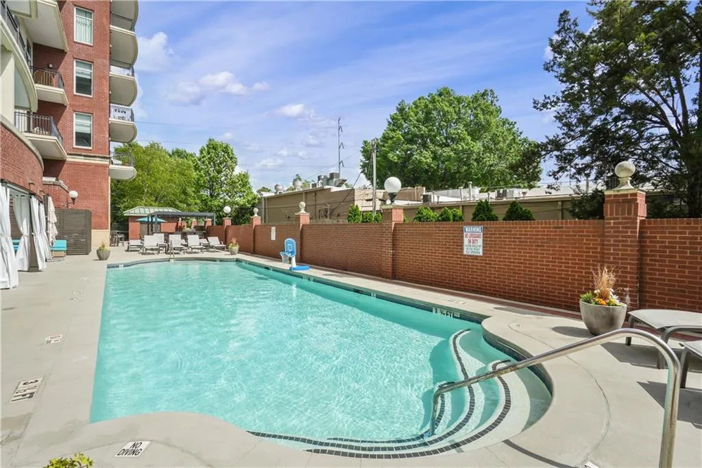 Community pool featuring a patio area