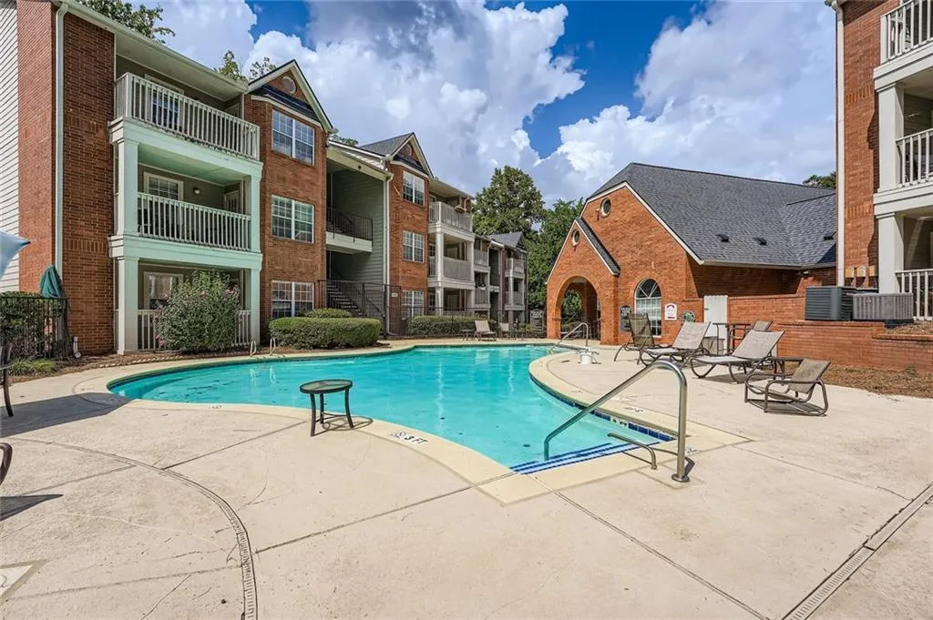 Community pool featuring a patio area