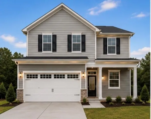Two-story gray siding exterior with black shutters and a covered entry porch