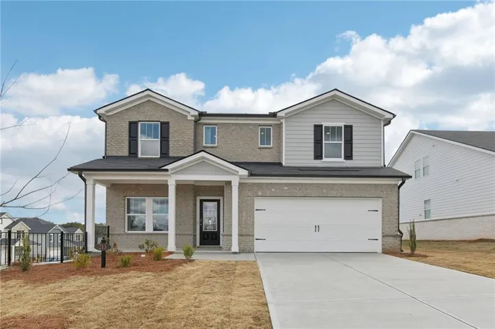 View of front of home featuring covered porch, brick siding, concrete driveway, and an attached garage
