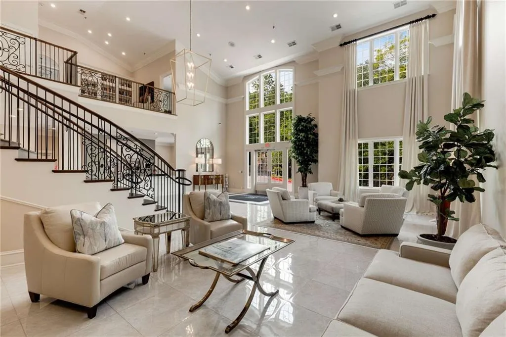 Greystone's Gorgeous Entrance Lobby.  The upstairs view is of the library and door to the game room.  There's also a huge club room club with a catering kitchen and it overlooks the saltwater swimming pool.