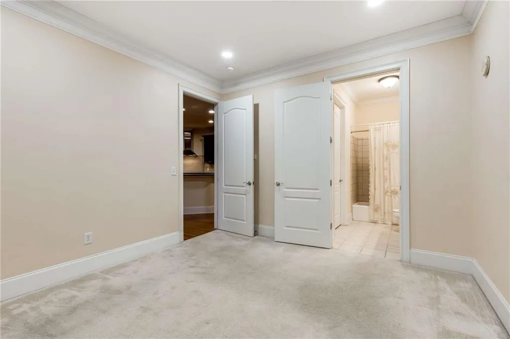 The 3rd bedroom has recessed ceiling lights and an ensuite bathroom.