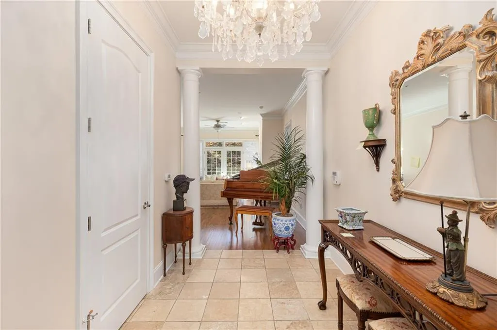 Suite 305's beautiful Foyer with view of the Living Room (BEFORE THE FURNITURE WAS REMOVED).