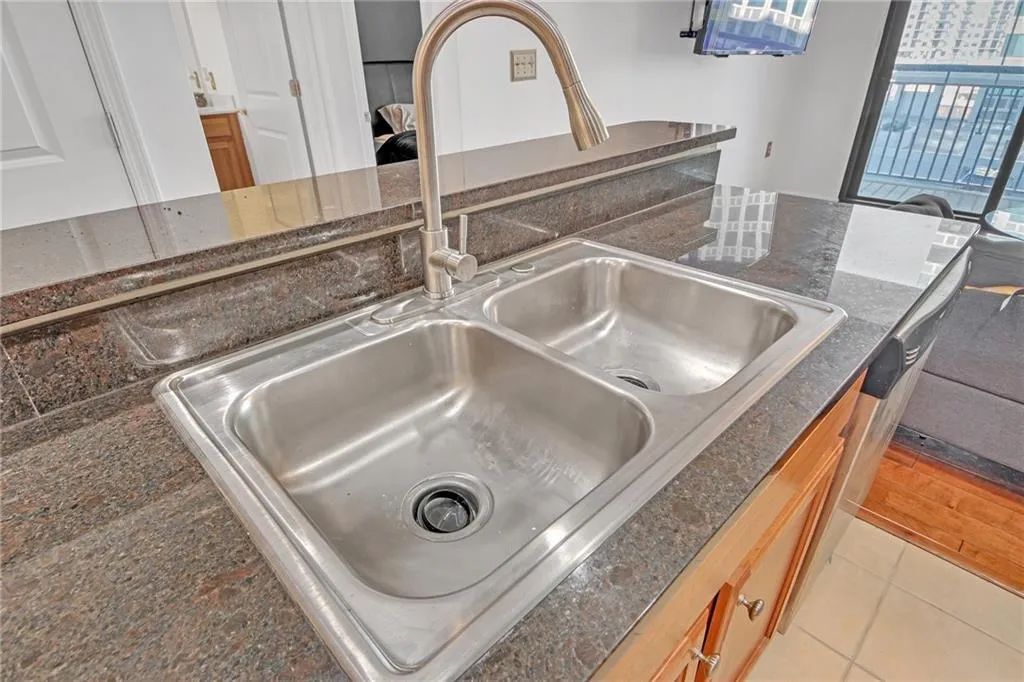 Interior details featuring dark stone countertops and sink