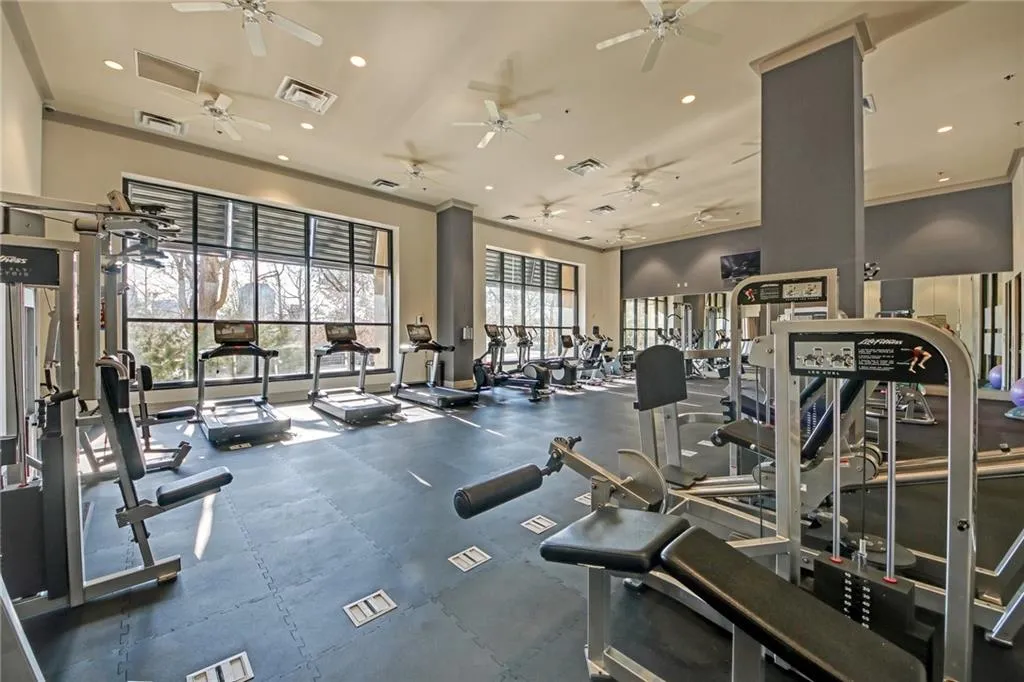 Exercise room featuring ornamental molding