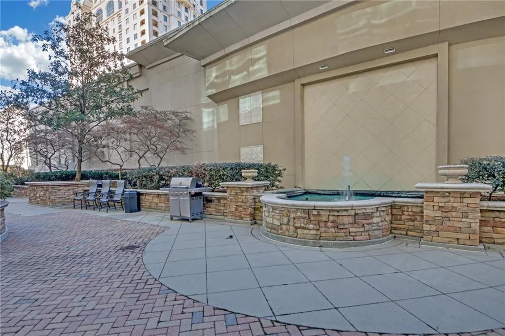 View of patio featuring area for grilling