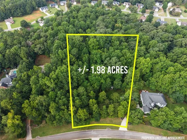 Wooded lot offering +/- 1.98 acres LOT OUTLINE IS APPROXIMATE