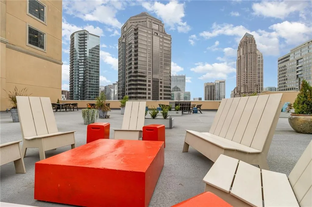 View of patio featuring outdoor dining space and a skyline view