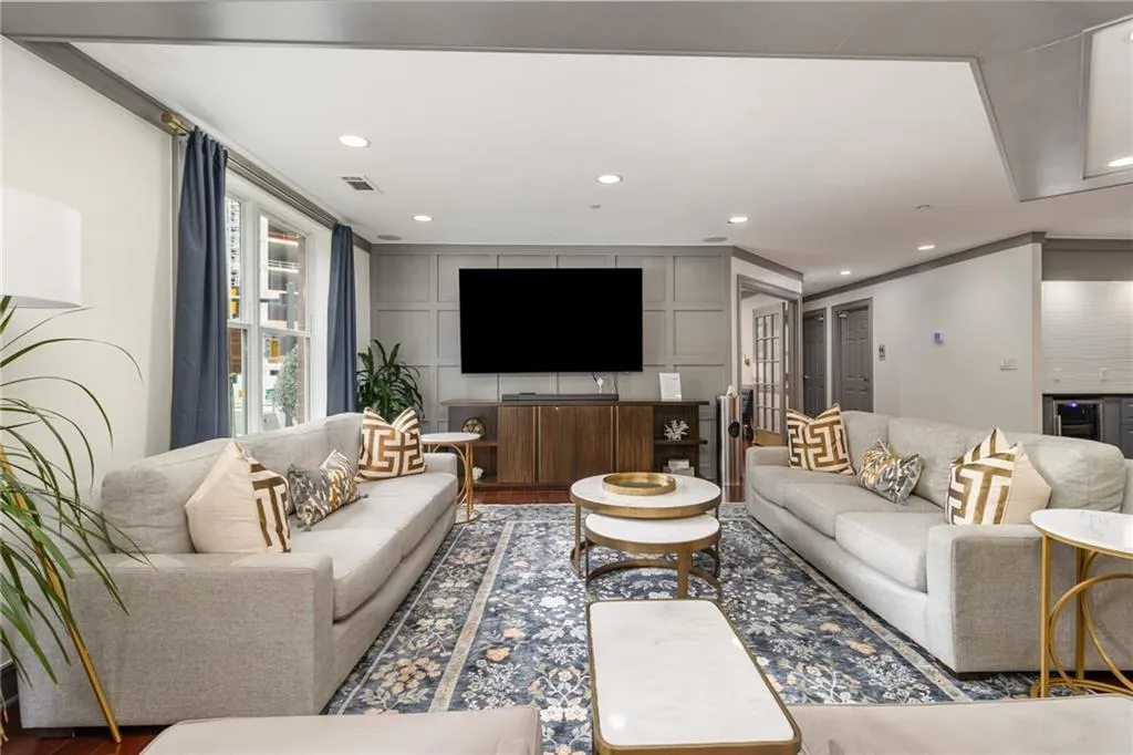 Living room featuring recessed lighting, wine cooler, and wood finished floors