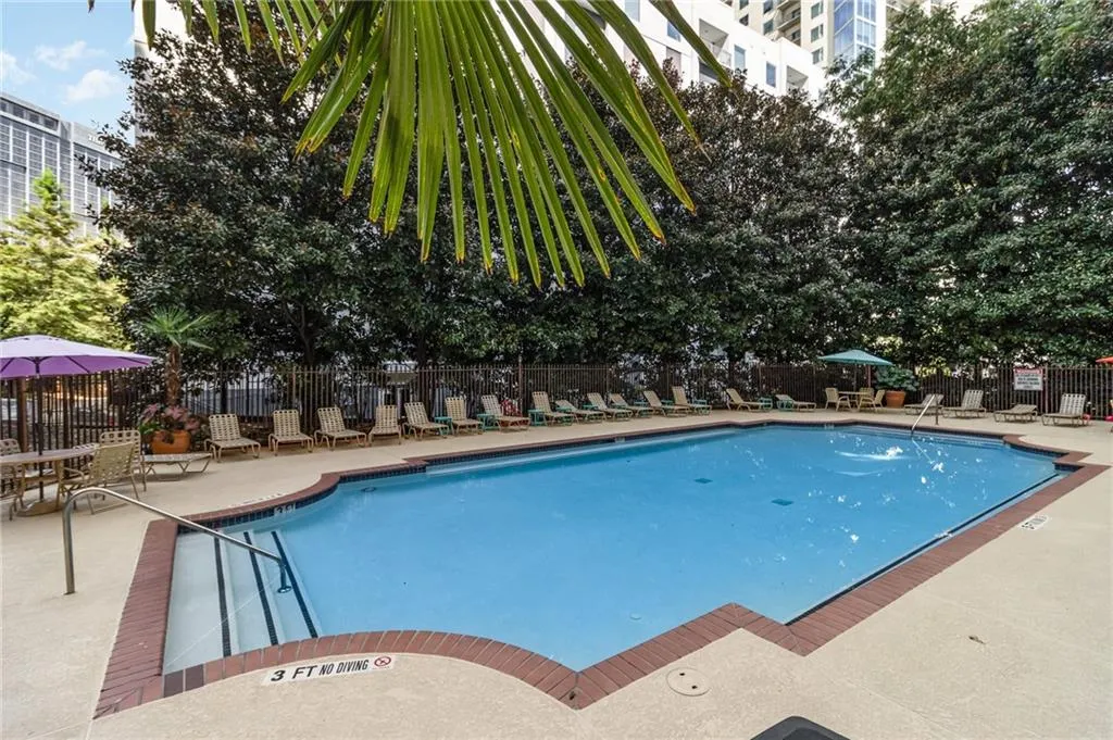 Community pool featuring a patio