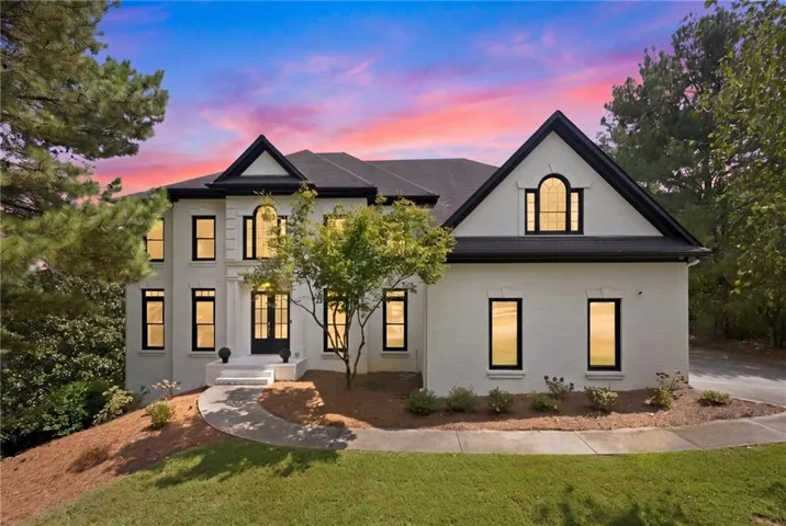 Two-story brick exterior with black framed windows