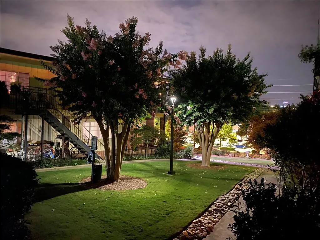 Surrounding community with a lawn and stairway