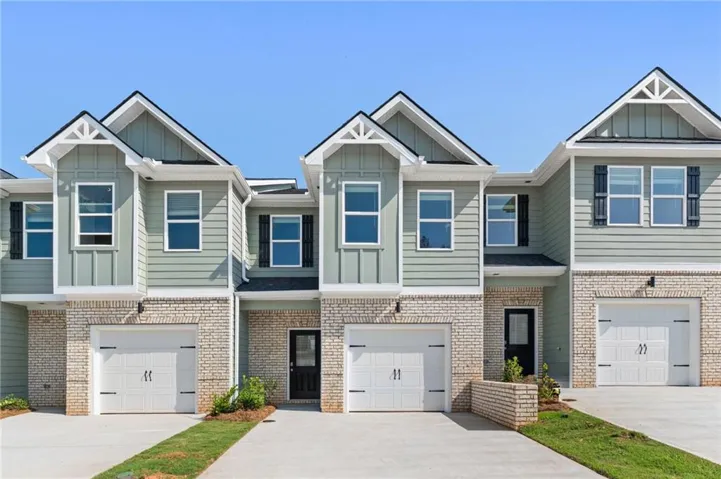 Contemporary townhome exteriors featuring brick and siding finishes