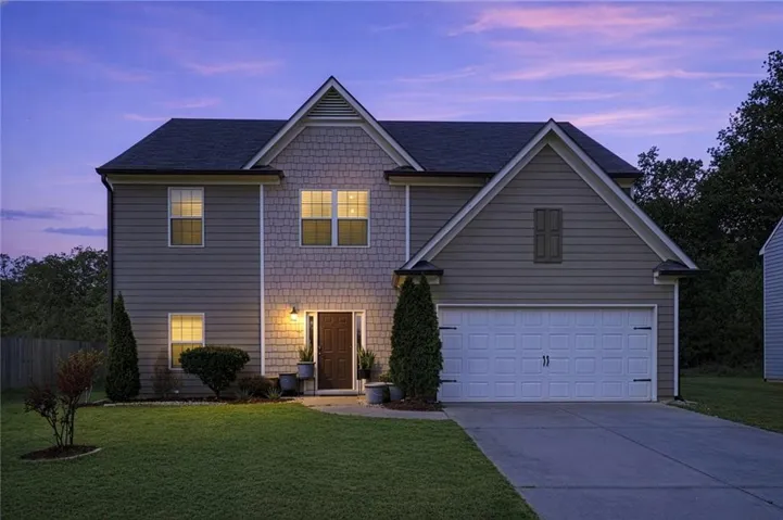 Two-story residence featuring a combination of horizontal siding and decorative shake siding