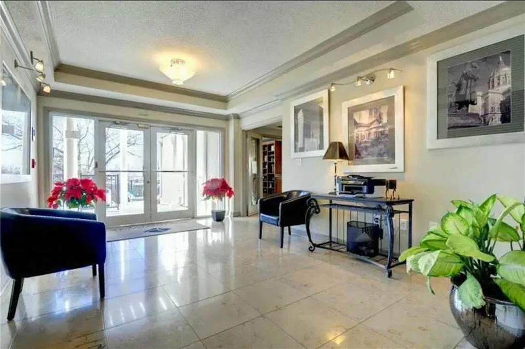 Lobby featuring a textured ceiling and crown molding