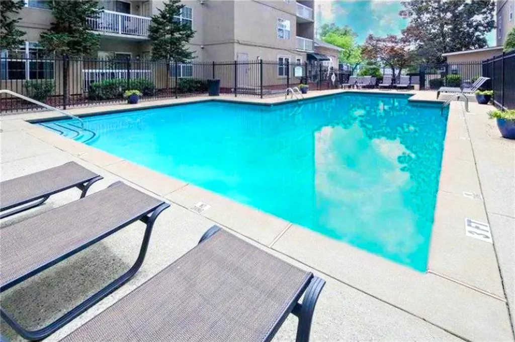Community pool featuring a patio
