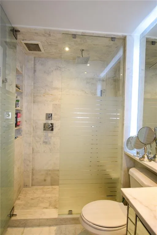 Bathroom with a walk in shower and vanity
