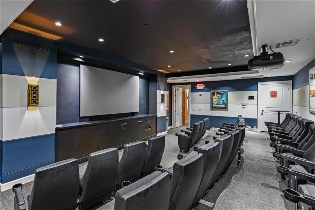 Home theater with carpet and recessed lighting