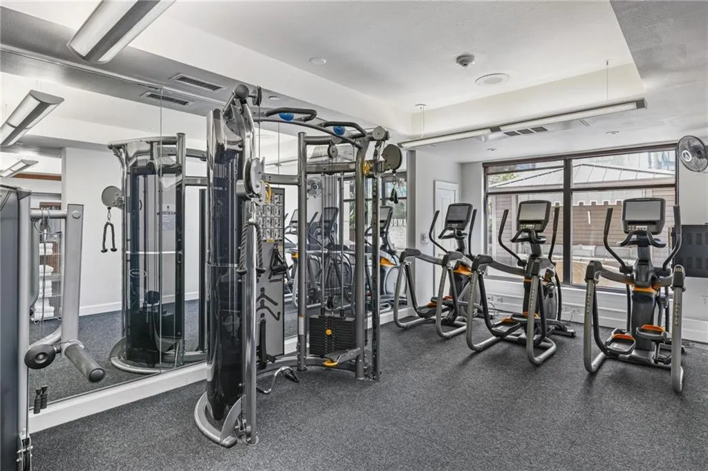 Gym featuring a tray ceiling